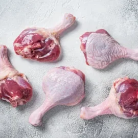 A bulk package of premium, frozen wholesale duck legs, neatly arranged and showcasing their meaty quality.