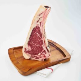 A thick-cut, beautifully marbled 45 Days Dry Aged Barley Fed Bone-in Striploin MS3+ ready for cooking.