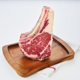 Close-up of a beautifully marbled Dry Aged Barley Fed Prime Ribs MS3+ before cooking.