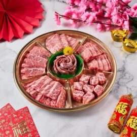 A beautifully arranged A5 Wagyu Beef Yakiniku Platter showcasing six different premium cuts with intricate marbling.