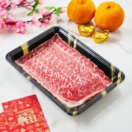 Paper-thin slices of A5 Wagyu Top Round Shabu arranged beautifully, showcasing its delicate marbling.