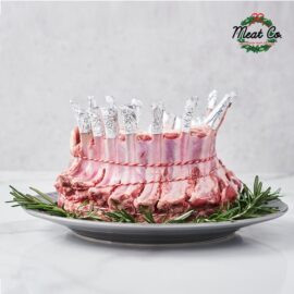 A beautifully prepared Lamb Crown Roast, ready for cooking, displayed on a clean surface.
