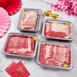 A tray showcasing four varieties of thinly sliced beef for the Beef Lover Shabu Set, including beautifully marbled Hanwoo-style beef.