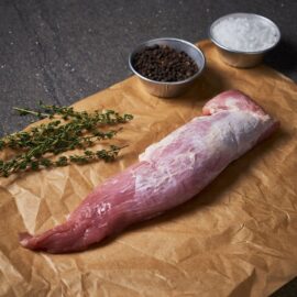 A fresh, raw Dingley Dell Pork Tenderloin ready for cooking.