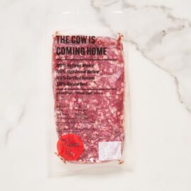 A close-up of fresh, bright red beef mince 80/20 ready for cooking.