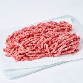 A close-up of coarse-ground Frozen Grassfed Beef Mince 80/20, showing its rich red color and texture.