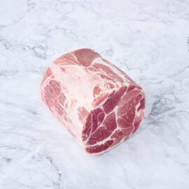 A premium, well-marbled frozen pork collar roast ready for cooking.