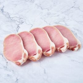A tray of perfectly cut 1cm thick frozen pork loin steaks, ready for cooking.