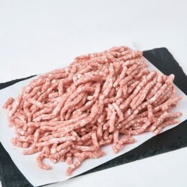 A close-up of high-quality Frozen Pork Mince Lean 90/10, showing its fresh pink color and uniform texture.