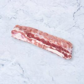 A full rack of premium, frozen pork prime ribs, neatly packaged and ready for cooking.