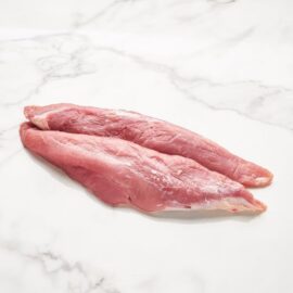 A perfectly trimmed, frozen pork tenderloin ready for preparation.