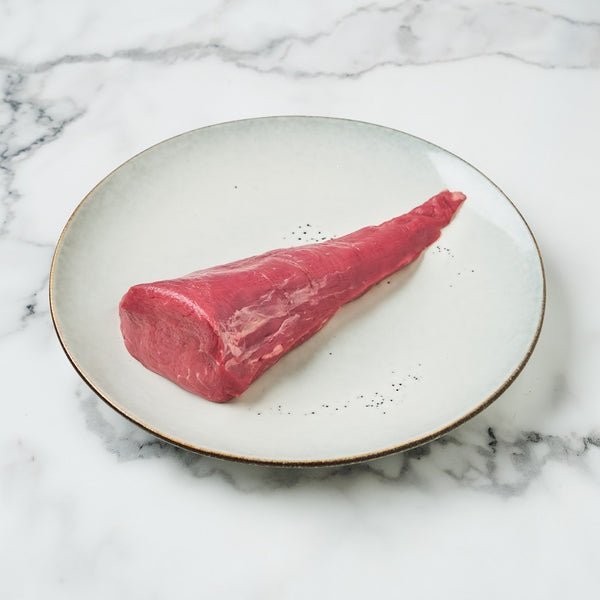 A fresh, richly colored grassfed beef tenderloin tail, ready for preparation.