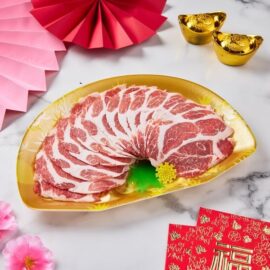 Paper-thin slices of beautifully marbled Iberico Pork Collar Shabu arranged artfully for a gourmet hot pot experience.