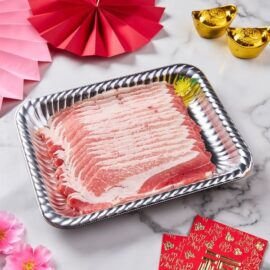 Beautifully marbled, paper-thin slices of Kurobuta Pork Belly Shabu arranged neatly for a hot pot meal.