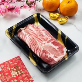 Paper-thin slices of Olive Fed Duroc Pork Collar Shabu arranged neatly for hot pot.