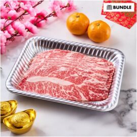 Paper-thin slices of USDA Prime Boneless Short Ribs for shabu-shabu, fanned out beautifully on a plate.